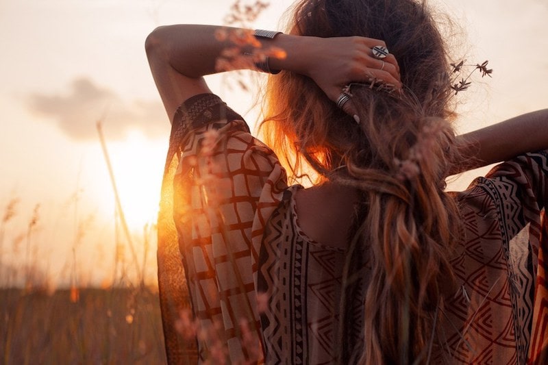 woman looking at sunrise, freedom, empath