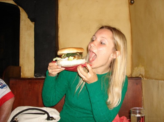 eating a huge veggie hamburger