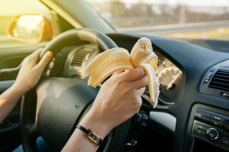 eating raw food whilst driving, banana