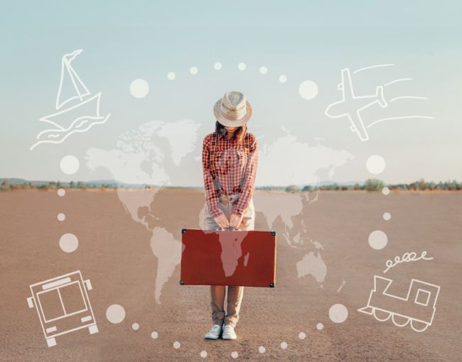 Traveler young woman standing with a suitcase on road. Map of the world and types of transport on image. Concept of travel