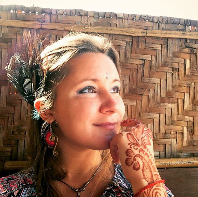 Anya Andreeva in Goa, India with feathers and henna mehendi hippy