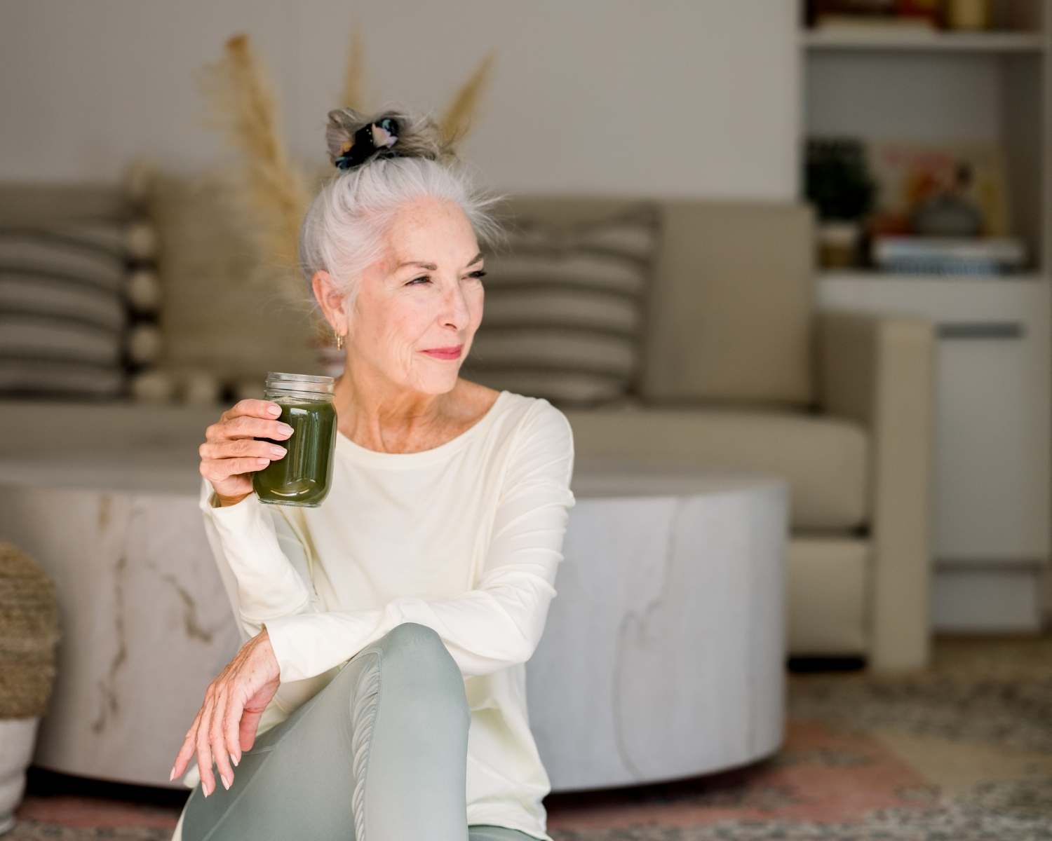 older woman with a green smoothie