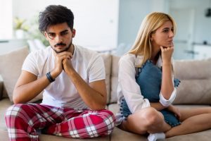 couple looking away from each other upset, relationship problems