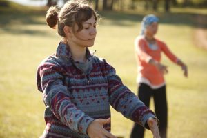 women doing qi gong in the park